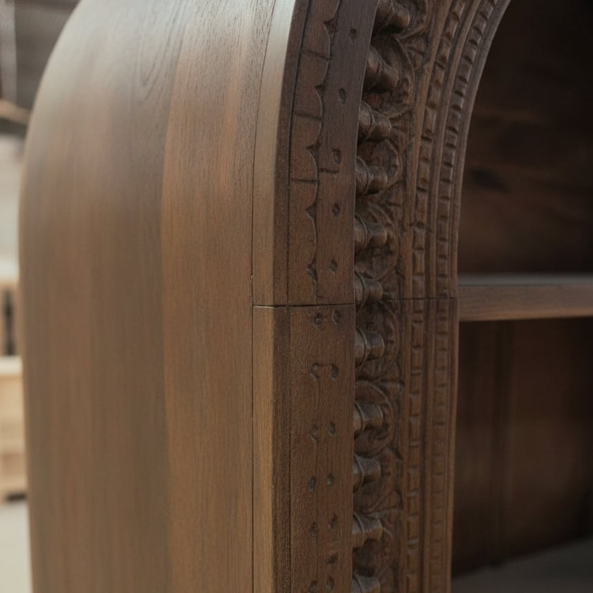 Close-up of the intricate carved wooden detail on the edge of the Aranya Display Shelf, showcasing fine craftsmanship and elegant decor.