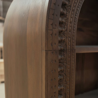 Close-up of the intricate carved wooden detail on the edge of the Aranya Display Shelf, showcasing fine craftsmanship and elegant decor.