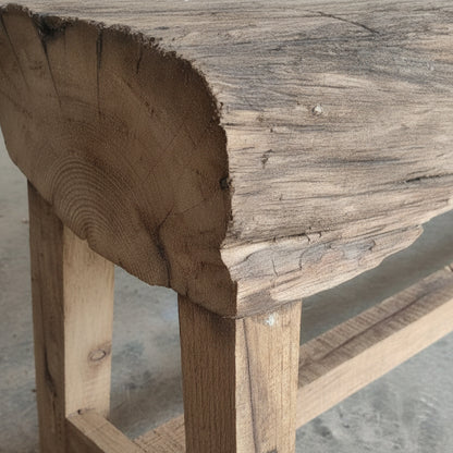 Close-up view of the natural wooden texture and grain on the Heritage Timber Bench, showcasing its handcrafted decor appeal with rustic and raw timber details.