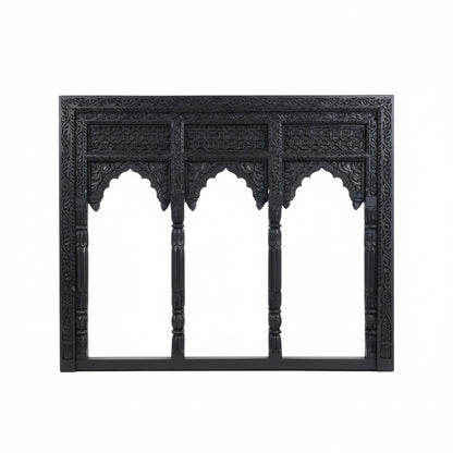 Jharokha Wall Hanging – a stunning handicraft decor piece featuring an ornate black carved wooden frame with three arched openings, detailed floral and geometric patterns, and decorative columns, set against a plain white background.