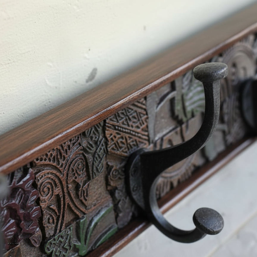 Close-up view of a wooden Karigar Block Coat Rack featuring a carved decorative panel and a sturdy black metal hook for hanging coats or accessories.