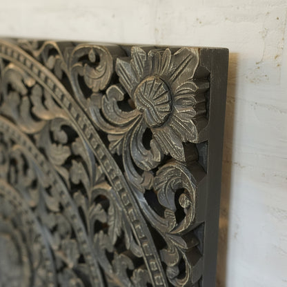 Hand-carved wooden wall art with intricate floral tribal patterns