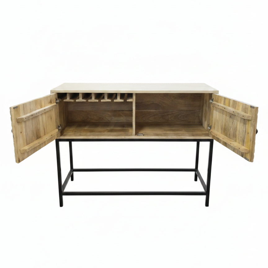 Open handcrafted wooden bar cabinet with rustic tribal design, featuring a sturdy metal frame, divided storage compartments, and hanging slots for glasses.
