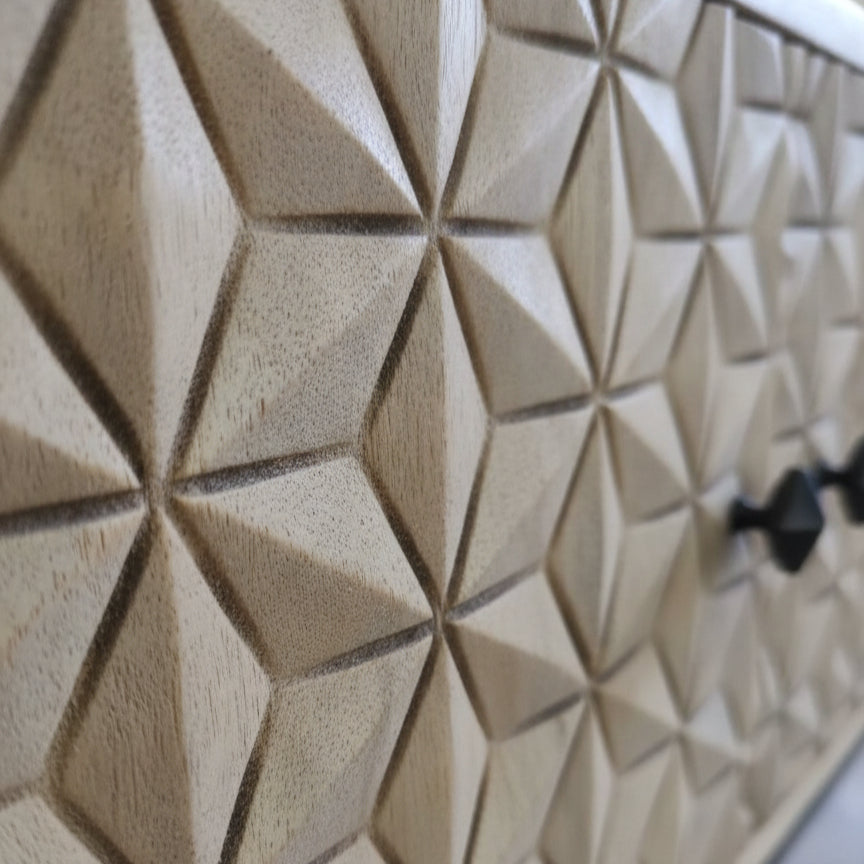 Close-up of the wooden geometric carved surface detail on the Naksha Bar Cabinet, showcasing intricate tribal handicraft decor.