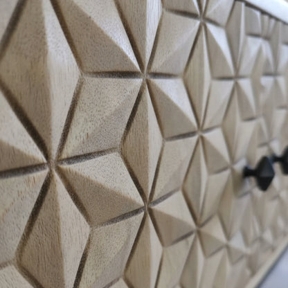 Close-up of the wooden geometric carved surface detail on the Naksha Bar Cabinet, showcasing intricate tribal handicraft decor.