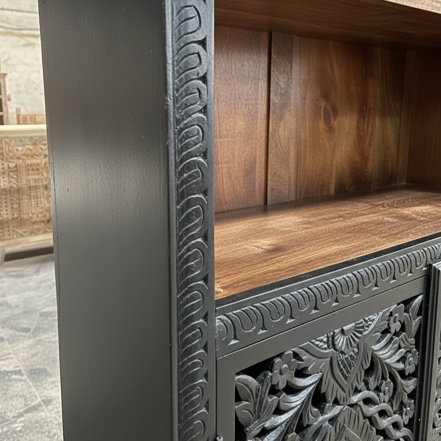 Hand-carved wooden cabinet with tribal patterns and dark wood finish
