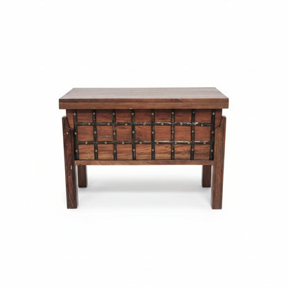 Wooden storage box with metal accents featuring a handcrafted tribal design, blending rustic decor and durable craftsmanship for unique home storage solutions.