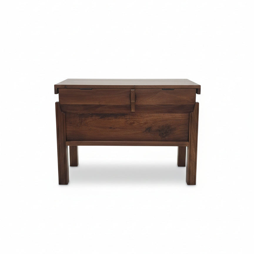 Solid wood storage box with tribal-inspired design, featuring a hinged top and sturdy legs, perfect for authentic handcrafted home decor and functional storage.
