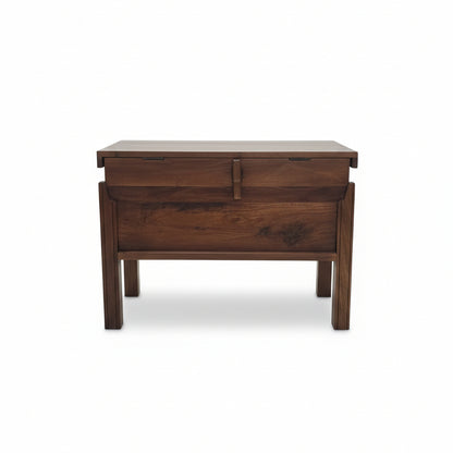 Solid wood storage box with tribal-inspired design, featuring a hinged top and sturdy legs, perfect for authentic handcrafted home decor and functional storage.