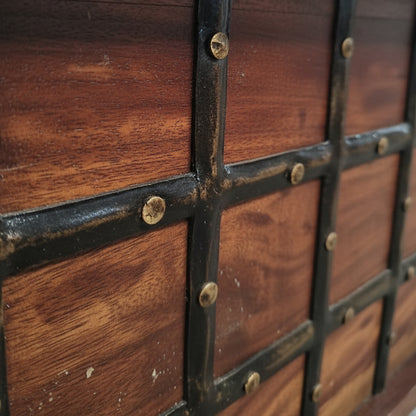 Close-up of the Sandook Metal Accent Storage Box showing its rustic wooden panels with black metal cross accents and brass-tone rivets, ideal for decor and handicraft displays.