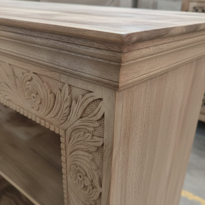 Handcrafted wooden furniture with floral carved detail, natural finish