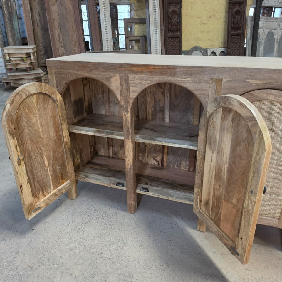 Open wooden sideboard with rattan cane doors showcasing handcrafted tribal decor and natural wood grain finish, highlighting artisanal quality and rustic charm.